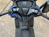 a close up view of a motorcycle ' s dashboard and handlebars