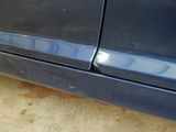 a car that has a denting on the side of it