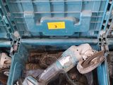 a blue tool box with tools in it on the floor