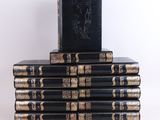 books stacked on top of each other on a white surface