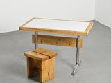 a wooden table with a white top and a wooden bench