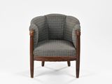 a grey chair with wooden legs and a patterned upholstered seat