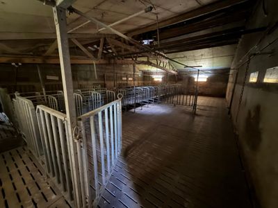 a room with a lot of stalls inside of it