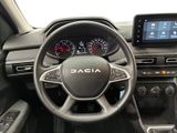 the interior of a car with a steering wheel and dashboard controls