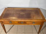 a small wooden table with two drawers on it