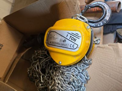 a box with a chain and a lever attached to it