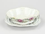 a small bowl and saucer sitting on a plate