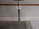 an image of a scale in a kitchen with a trash can