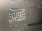 a close up of a laptop that has a battery on it
