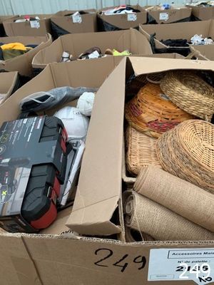 a cardboard box filled with assorted items in a warehouse