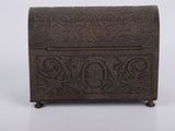 an old wooden box with a carved design on it
