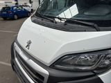 a white van that is parked in a parking lot