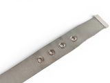 an image of a close up of a metal bracelet on a white surface