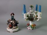 two figurines sitting next to each other on a table