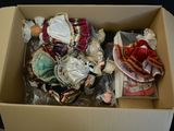 a cardboard box filled with assorted items on a table