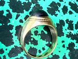 an image of a ring on a green surface