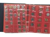 a lot of different coins in a red case