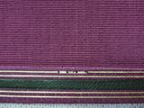 purple, green, and gold clutch bag with gold trim