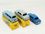three toy cars that are sitting on top of a box