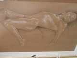 drawing of a nude woman laying on her stomach in a wooden frame