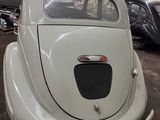 a white car that is parked in a garage