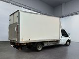a white truck that is parked in a large room