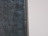 a mirror that has been broken in the corner of a room