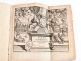 an old book with a drawing of a man sitting on top of a table