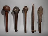 several different types of wooden spoons are lined up on a white surface