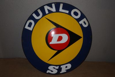 an image of a round sign with the word dunlop sp on it