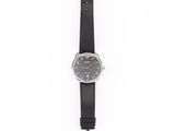 black leather strap watch with black dial on white background