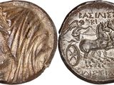 a silver coin with an image of a woman on it