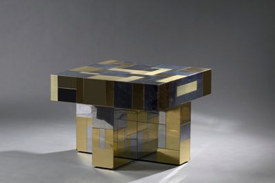a gold and blue table with a glass top