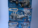 three lego tech vehicles are sitting on a white surface