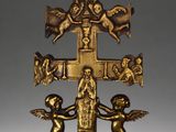 an image of a gold cross with angels and a bird on it