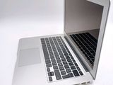 a laptop computer that is sitting on a white table