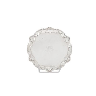 a silver plate with a monogram on it