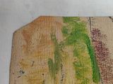 a picture of a piece of wood with a painting on it