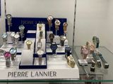 a lot of watches on display in a glass case