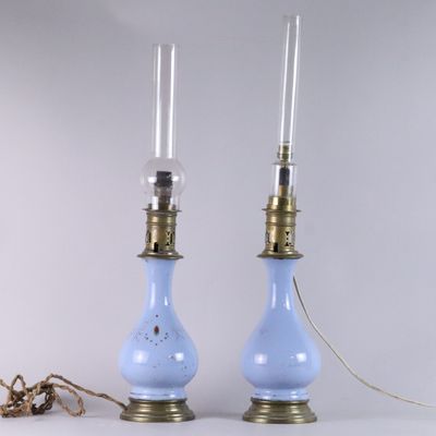 pair of blue glass lamps with brass fittings and a rope