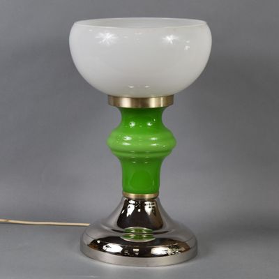 an image of a green and white lamp on a silver base