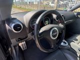 the interior of a car with a steering wheel and dashboard