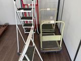 several different types of ladders are lined up against a wall