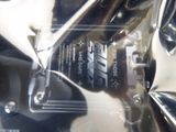 a close up of a motorcycle that is wrapped in plastic