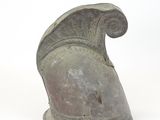 roman helmet on a white surface with a white background