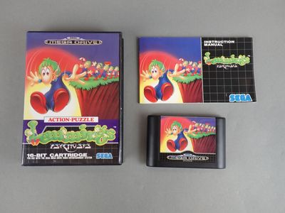 two nintendo games sitting on top of a table next to each other