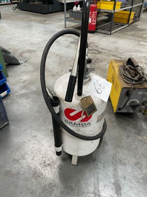 a vacuum that is sitting on the floor in a warehouse