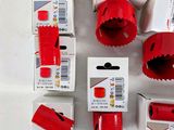 a lot of red tools that are on the table