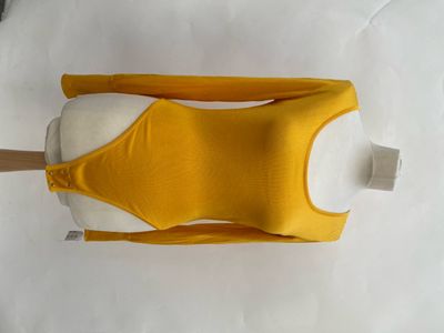a close up of a yellow dress on a mannequin mannequin