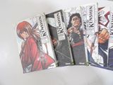 six books of anime comics are lined up on a table
